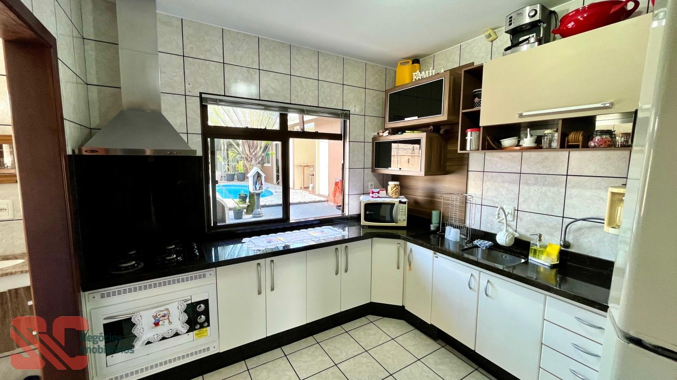 Casa com piscina no Carijós — foto 7